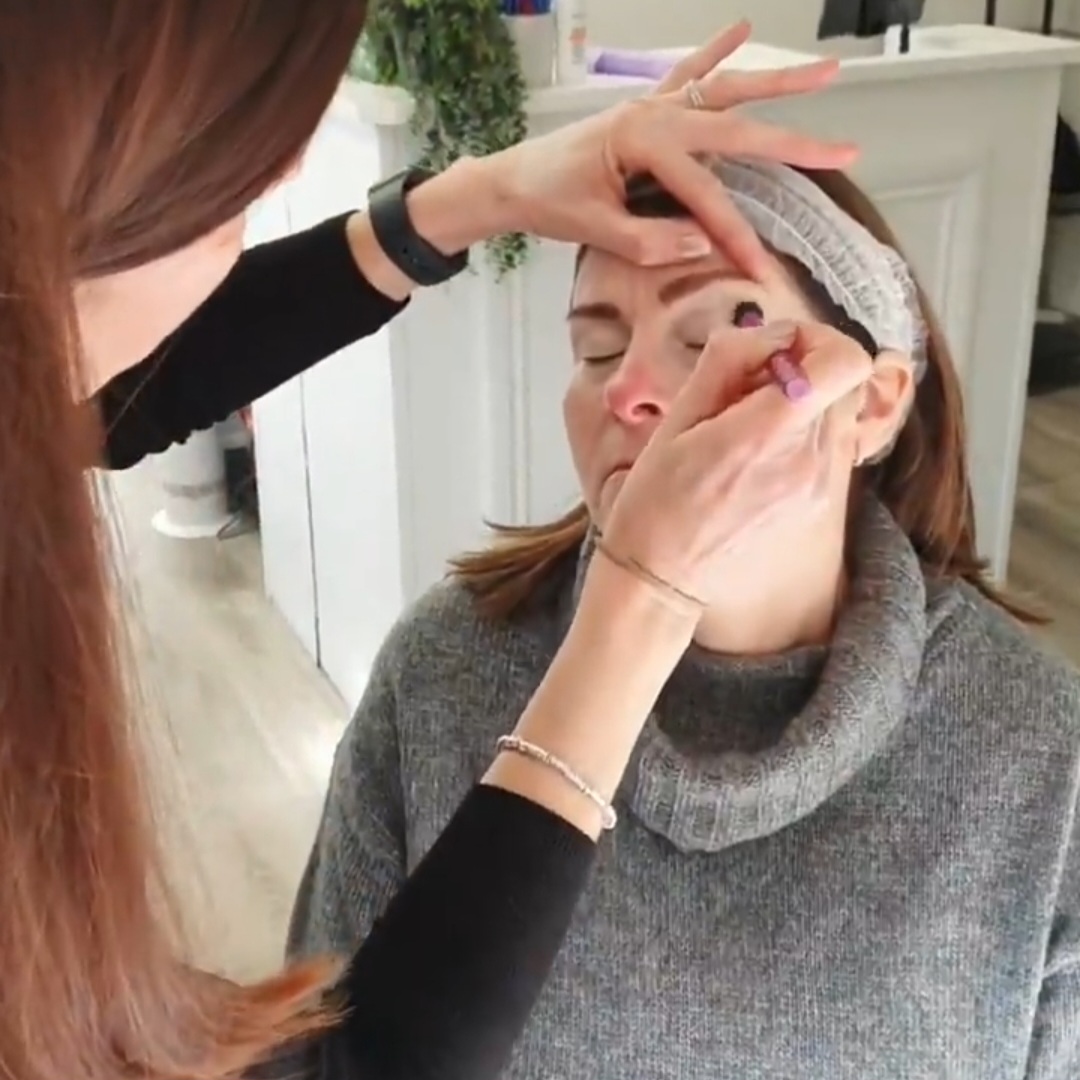 AuraLuxe make-up artistry course showing eye make-up being applied to a client.