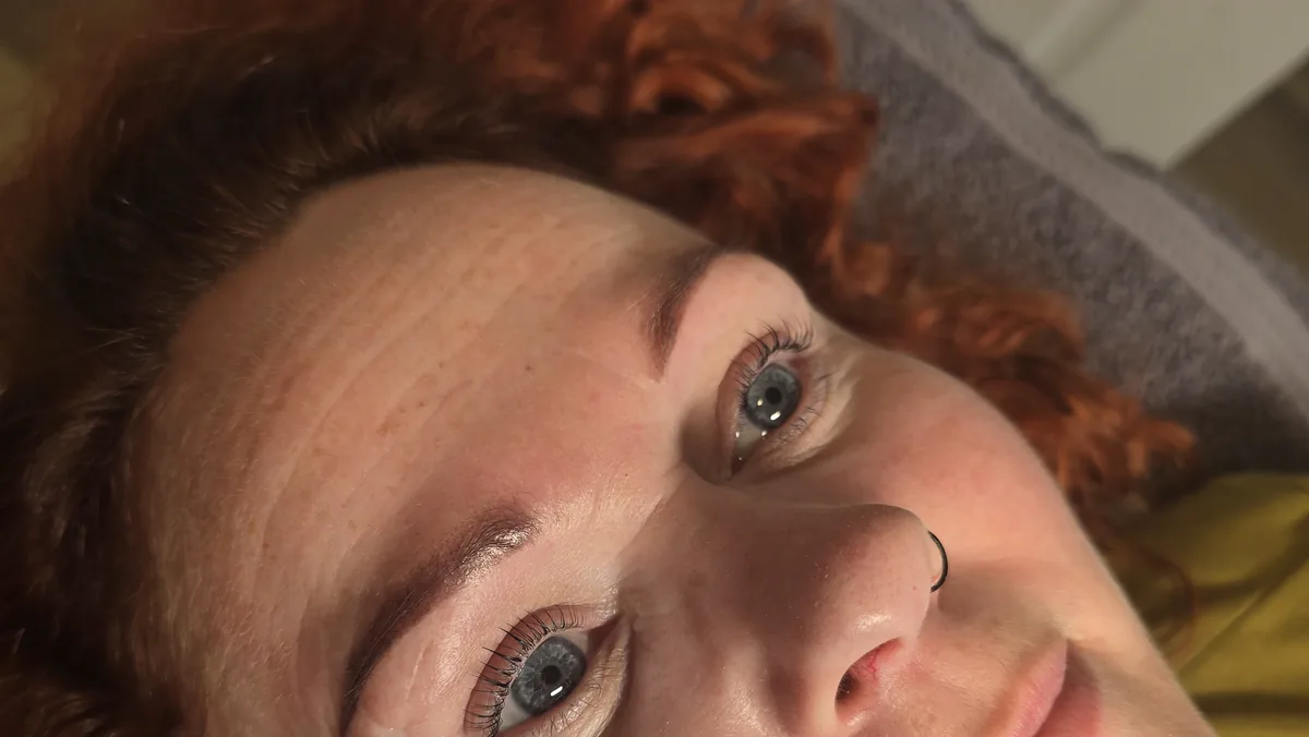 Finished lash lift and tint on a client with red hair, both eyes and brows in frame